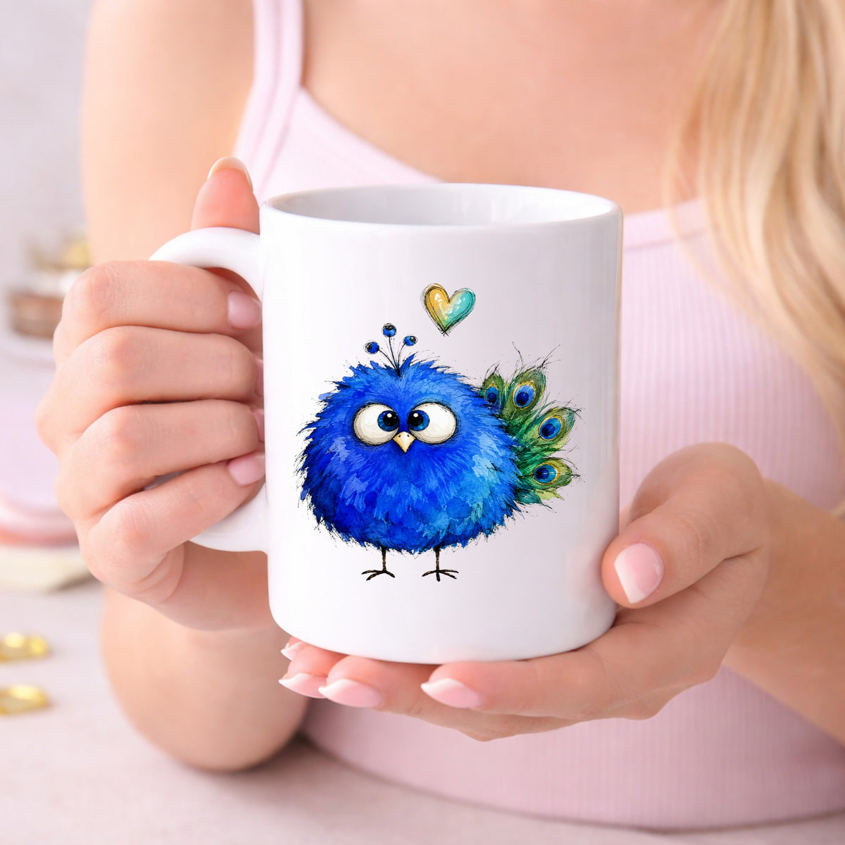 Blue Peacock Crest UV DTF sticker applied to a white coffee mug held in both hands