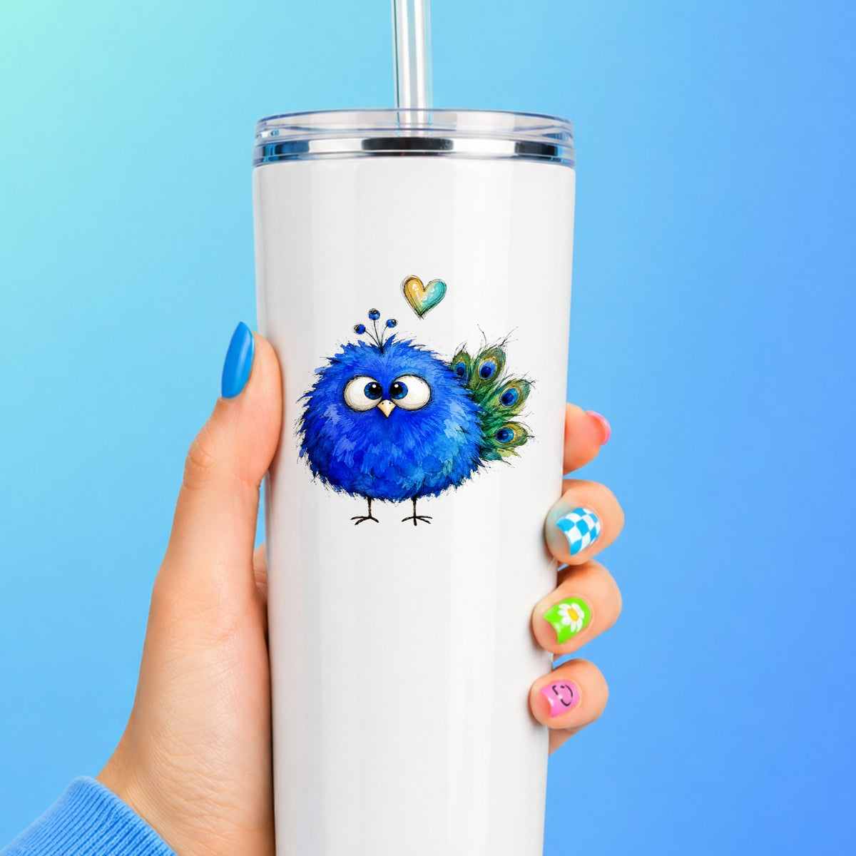 Blue Peacock Crest UV DTF sticker applied to a white straw tumbler on a blue background