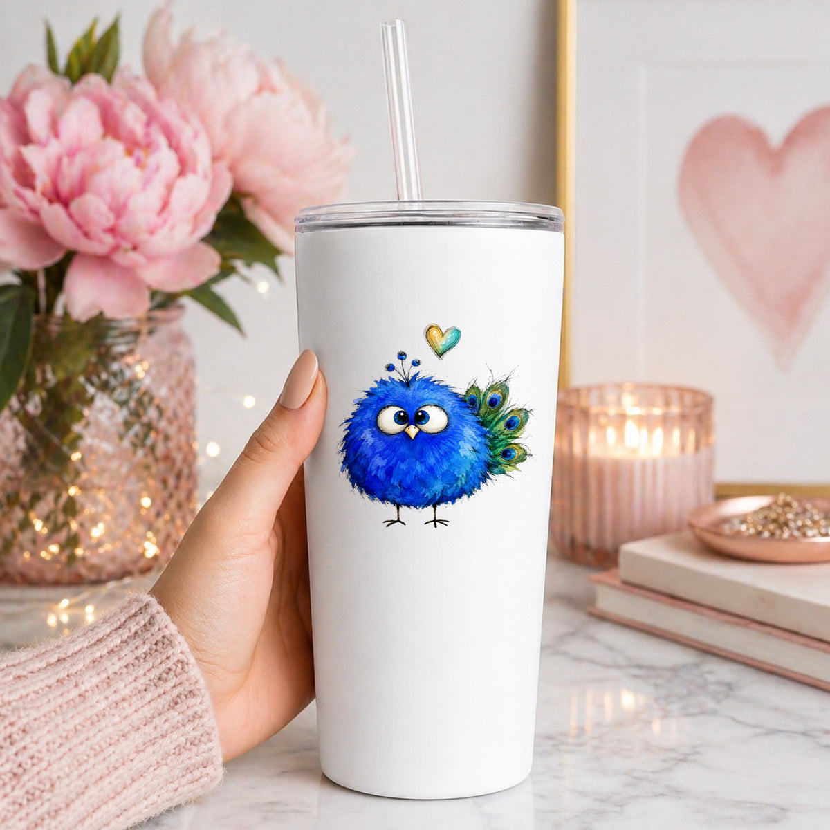 Blue Peacock Crest UV DTF sticker applied to a white straw tumbler beside pink peonies