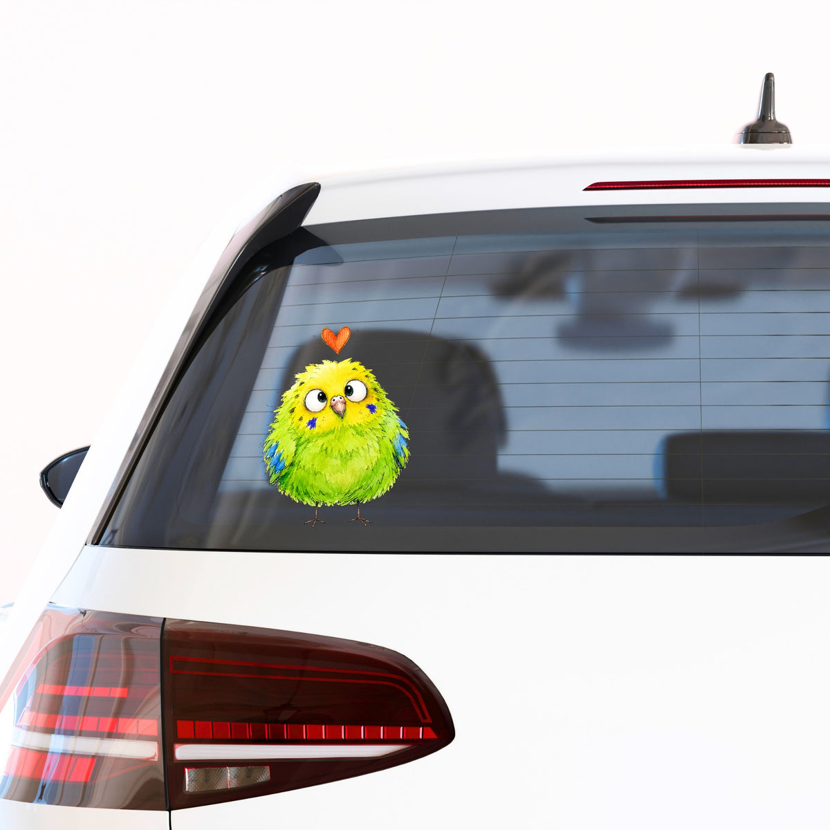 Funny Green Budgie UV DTF sticker applied to the rear window of a white car