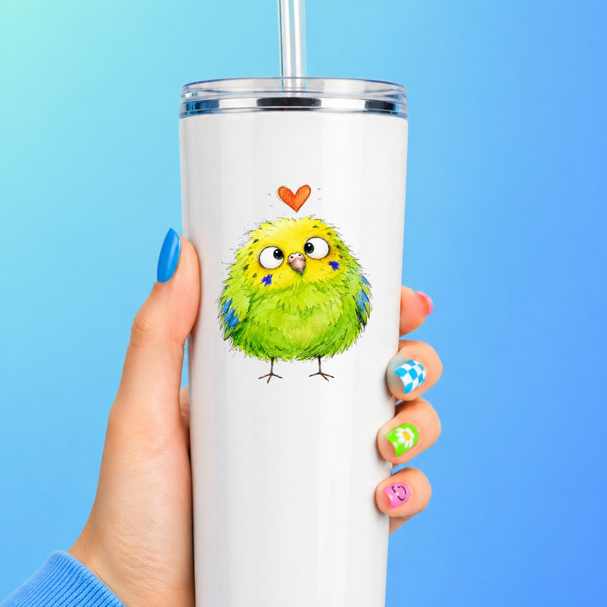 Funny Green Budgie UV DTF sticker applied to a white straw tumbler on a blue background