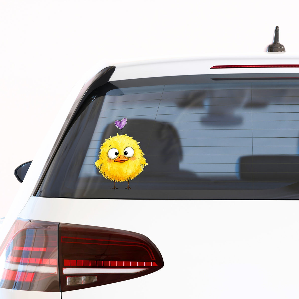 Funny Yellow Baby Duck UV DTF sticker applied to the rear window of a white car