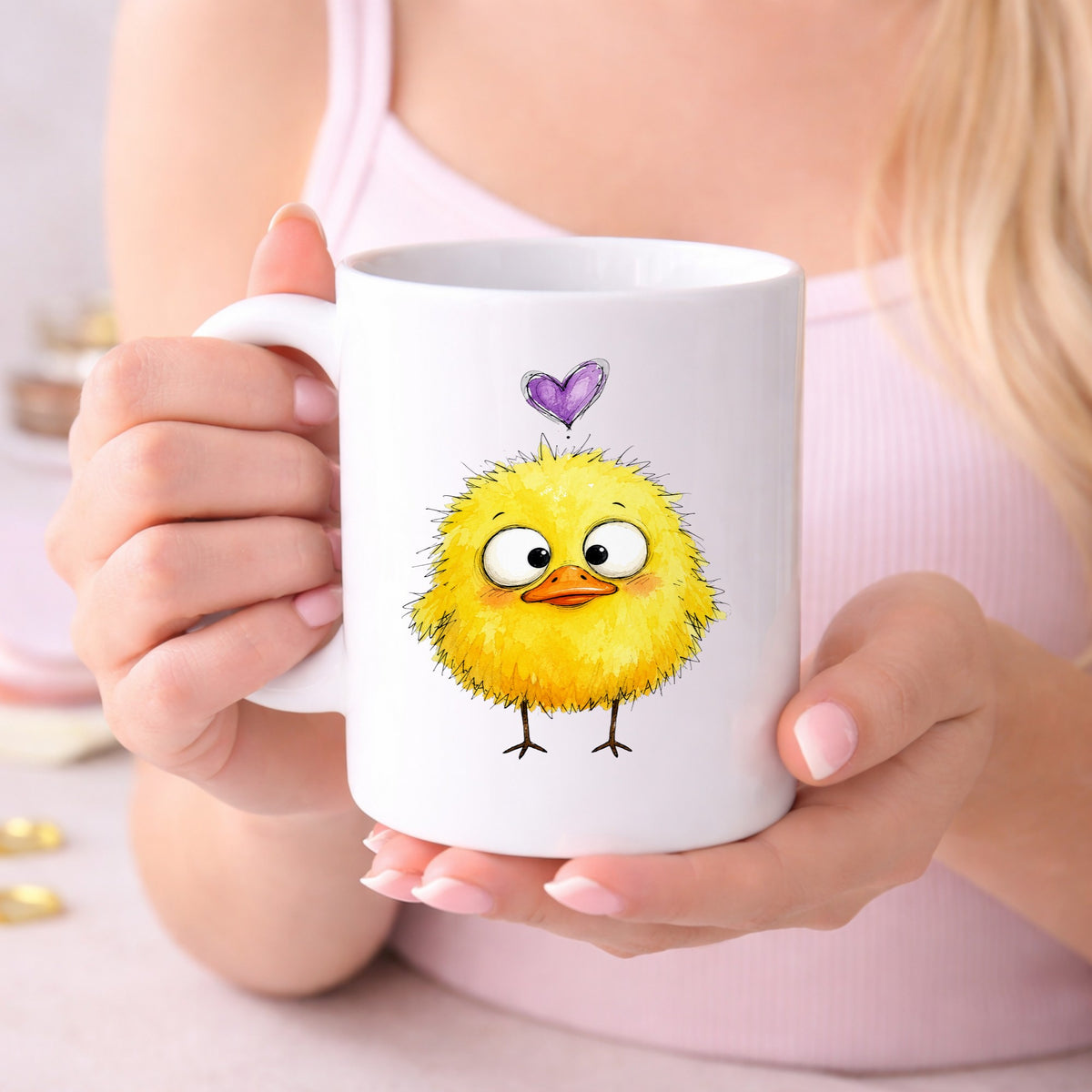 Funny Yellow Baby Duck UV DTF sticker applied to a white coffee mug held in both hands