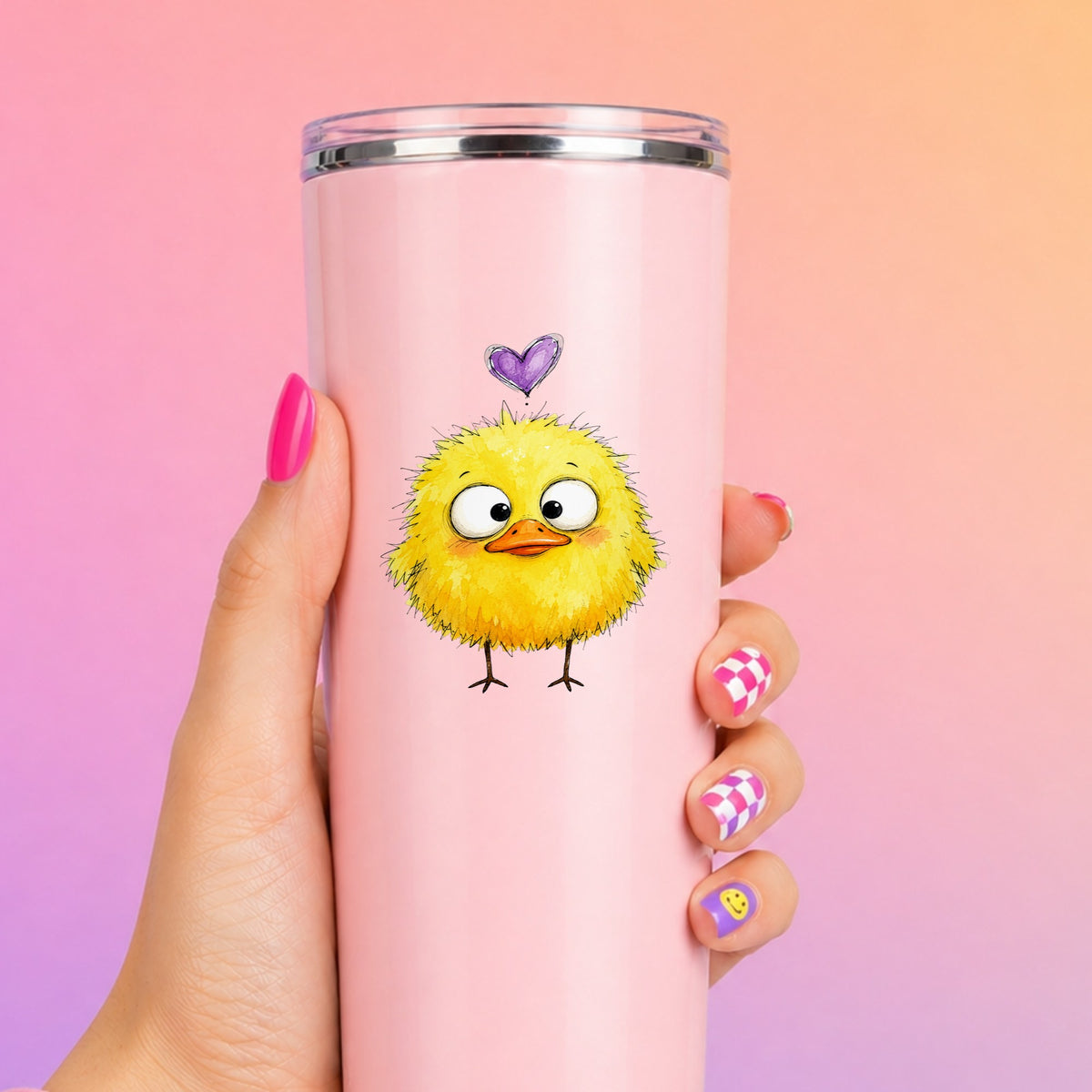 Funny Yellow Baby Duck UV DTF sticker applied to a tall pink tumbler on a pink and orange background