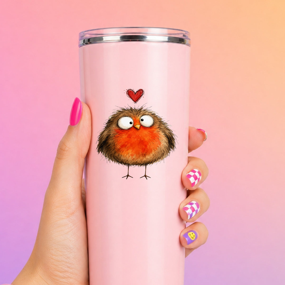 Round Robin Bird UV DTF sticker applied to a tall pink tumbler on a pink and orange background