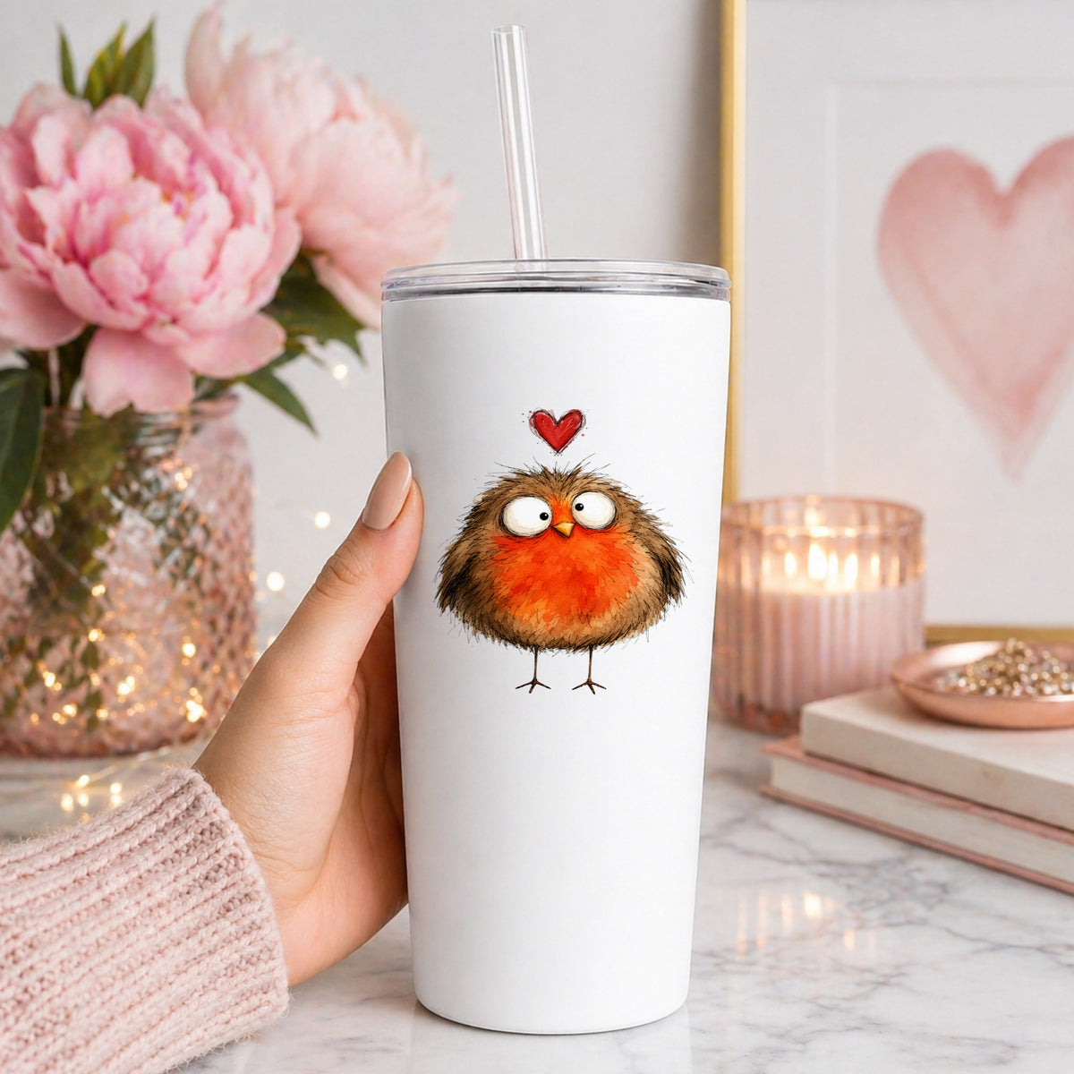 Round Robin Bird UV DTF sticker applied to a white straw tumbler beside pink peonies