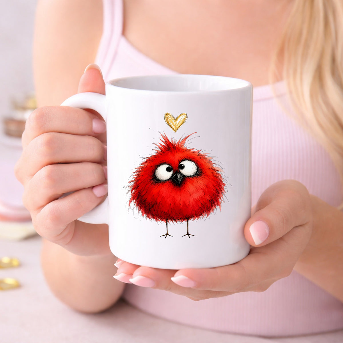 Funny Red Cardinal UV DTF sticker applied to a white coffee mug held in both hands