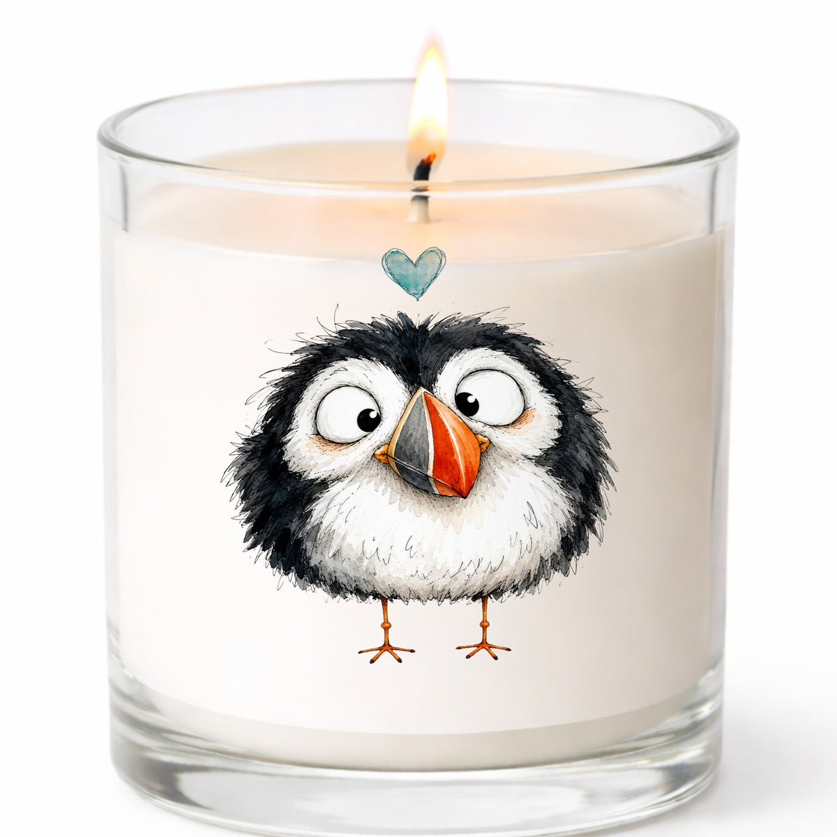 Cartoon Puffin UV DTF sticker applied to a white candle in a clear glass jar