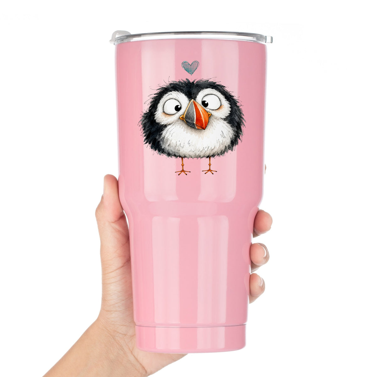 Cartoon Puffin UV DTF sticker applied to a pink tumbler held against a white background