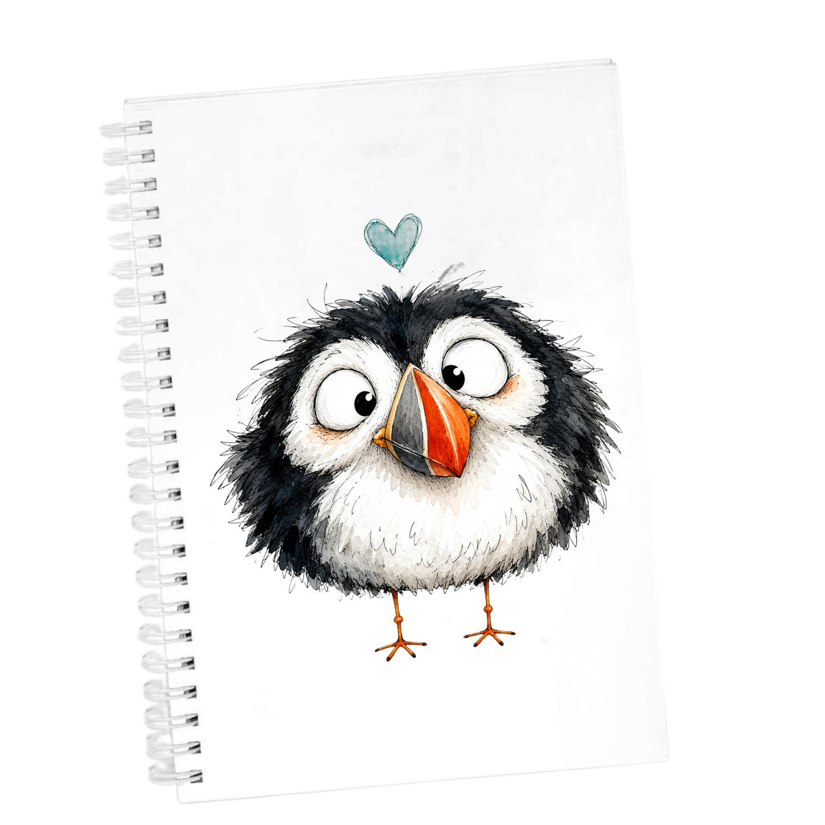 Cartoon Puffin UV DTF sticker applied to the cover of a white spiral journal