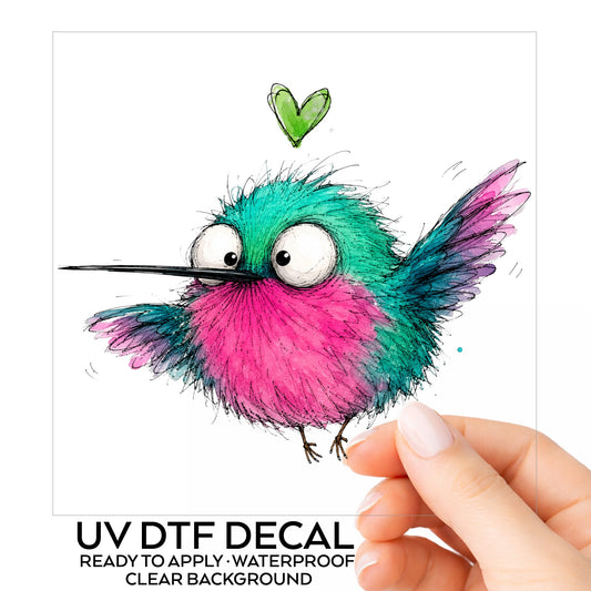 Flying Cartoon Hummingbird UV DTF sticker on its backing card, held in hand