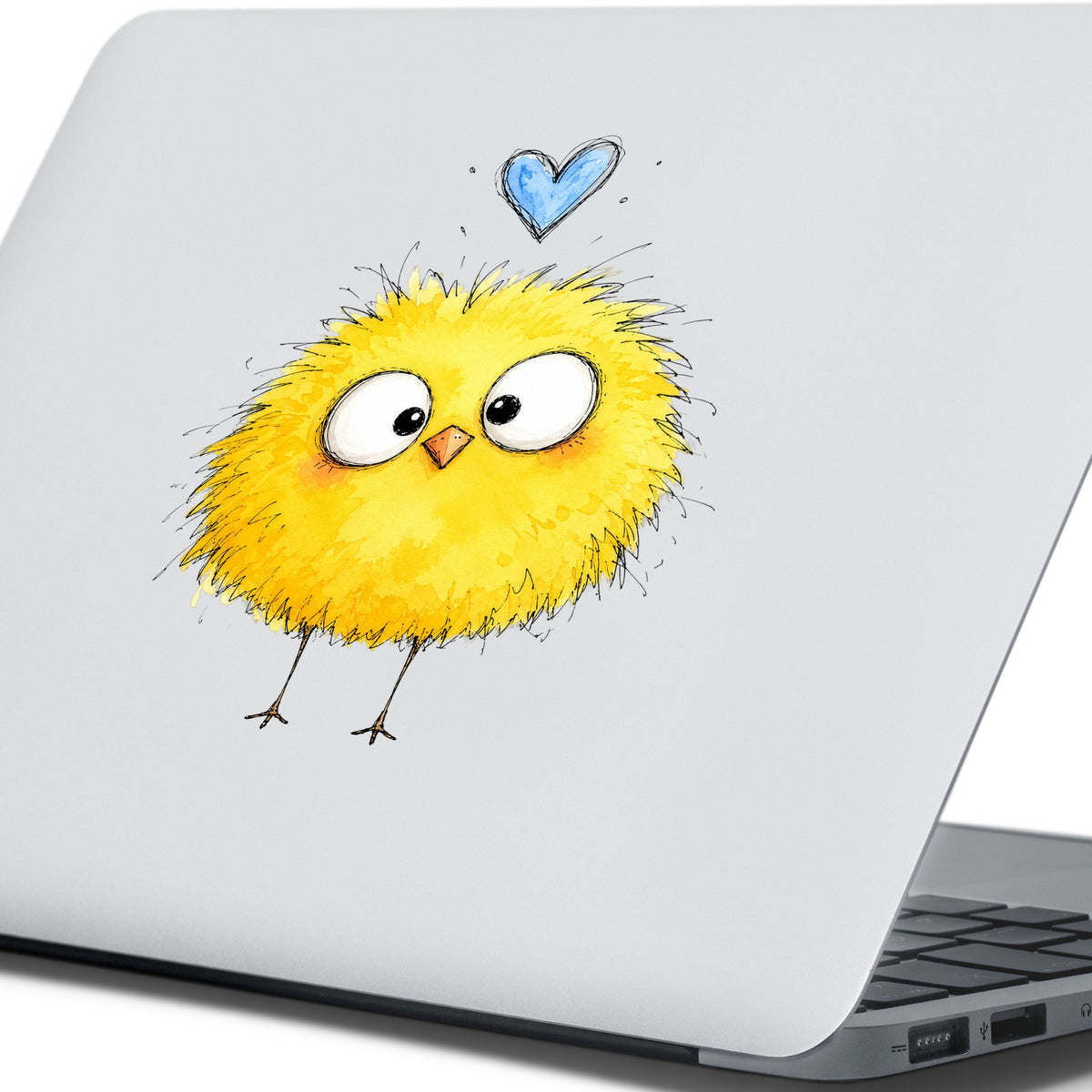 Fluffy Yellow Chick UV DTF sticker applied to the lid of a silver laptop