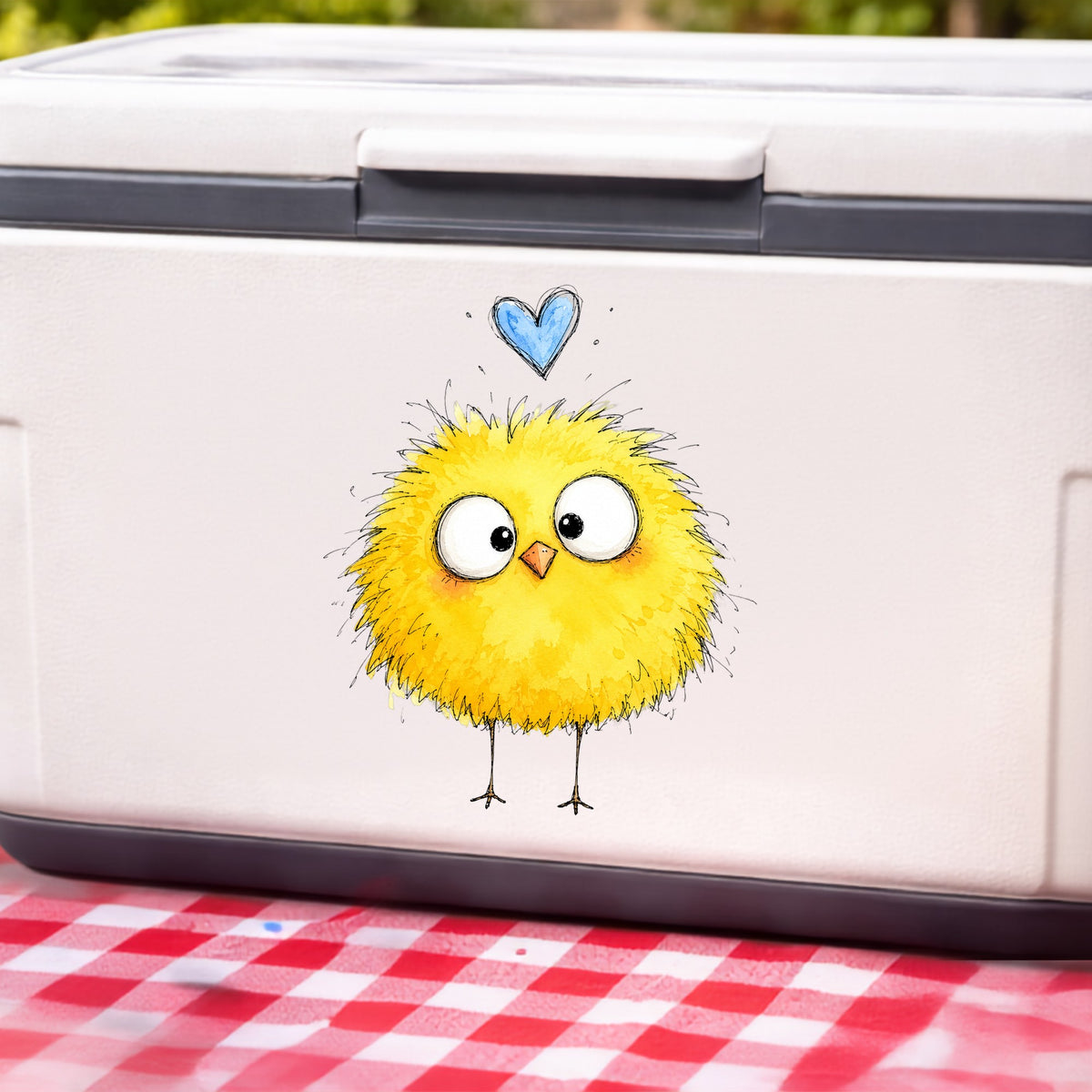 Fluffy Yellow Chick UV DTF sticker applied to a white cooler on a red gingham cloth