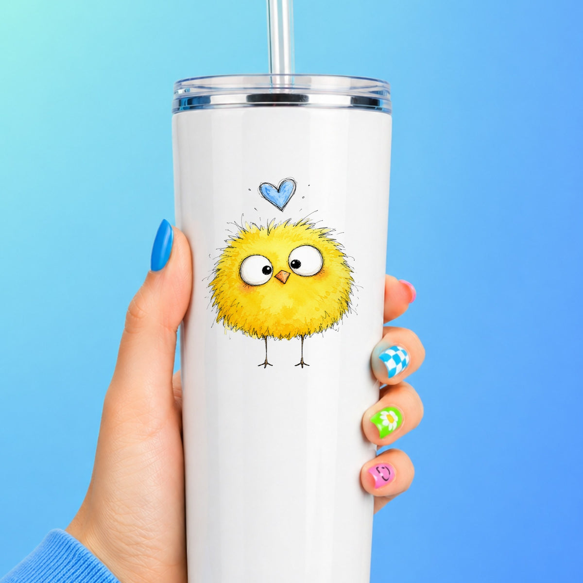 Fluffy Yellow Chick UV DTF sticker applied to a white straw tumbler on a blue background