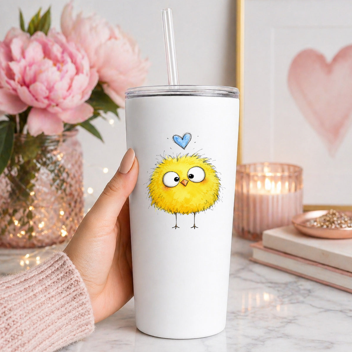 Fluffy Yellow Chick UV DTF sticker applied to a white straw tumbler beside pink peonies