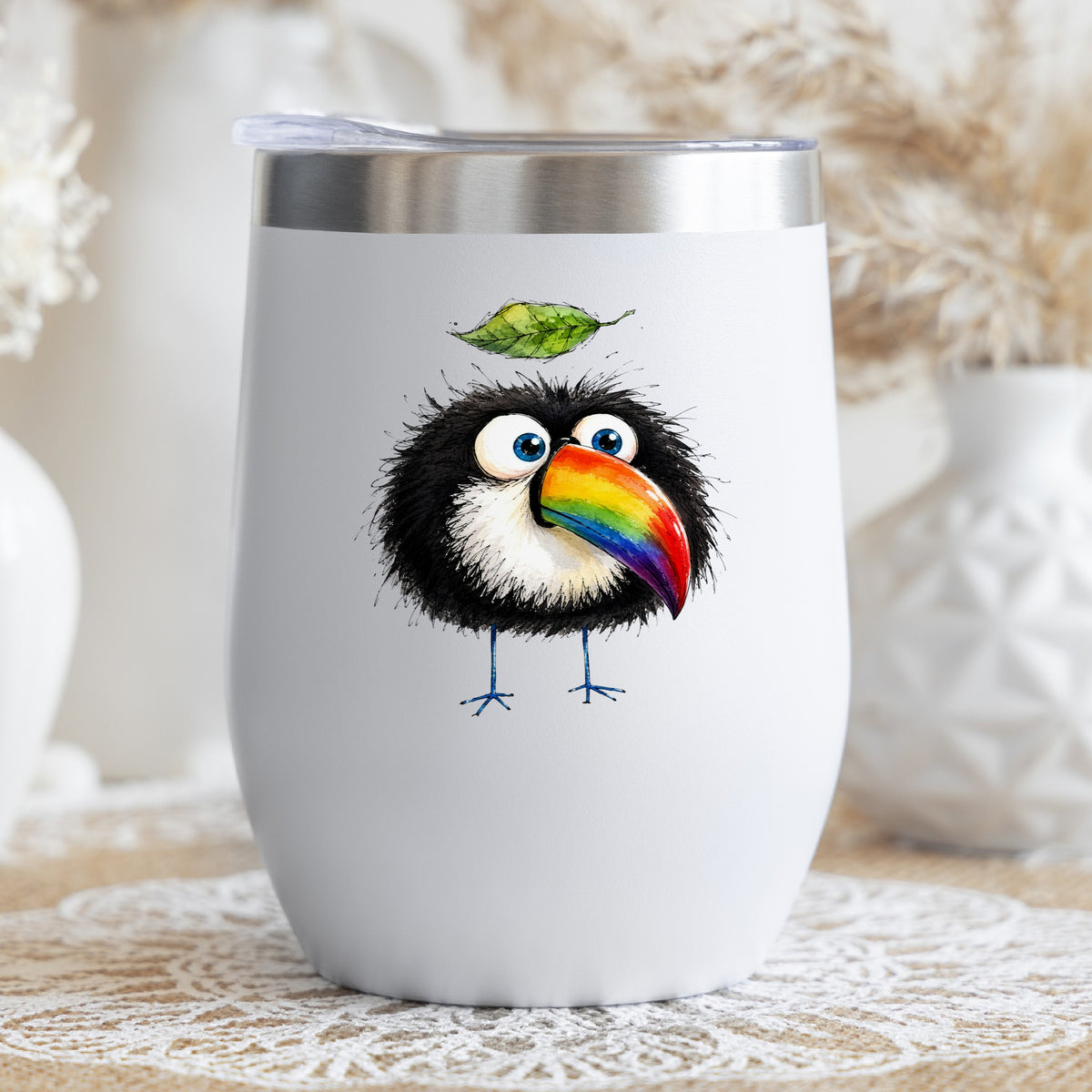 Toucan With Leaf UV DTF sticker applied to a white stemless tumbler with a lid