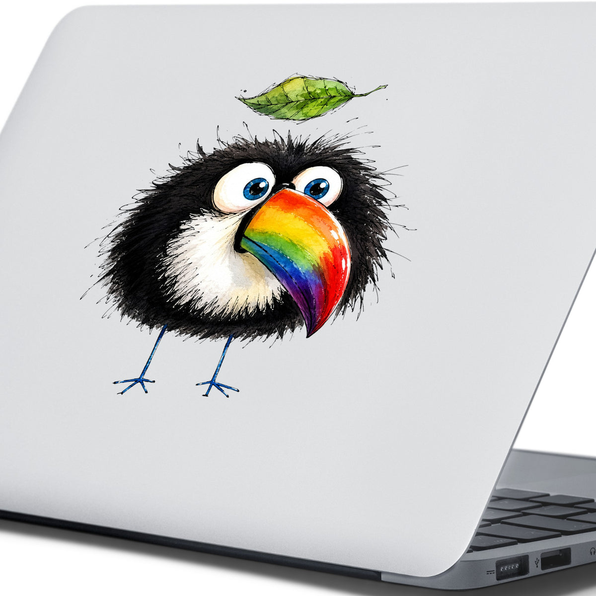 Toucan With Leaf UV DTF sticker applied to the lid of a silver laptop