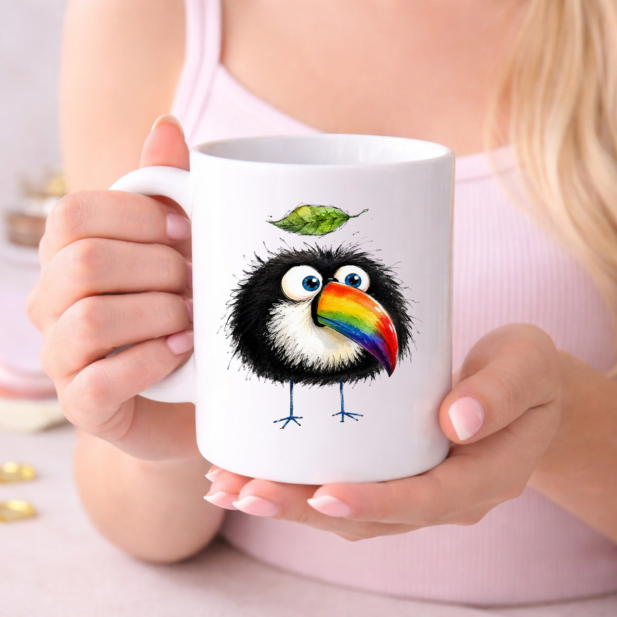 Toucan With Leaf UV DTF sticker applied to a white coffee mug held in both hands
