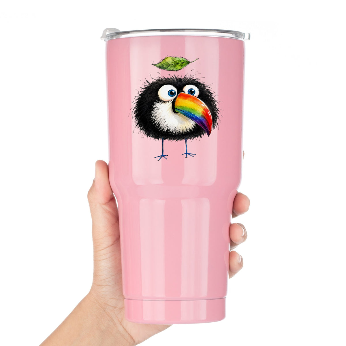 Toucan With Leaf UV DTF sticker applied to a pink tumbler held against a white background