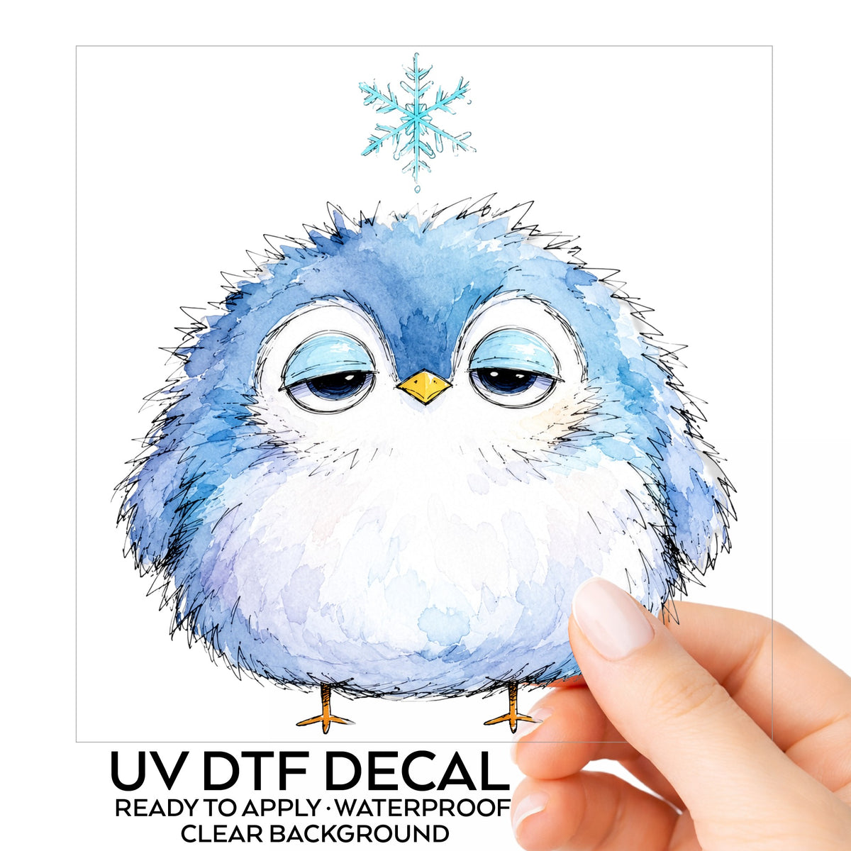 Sleepy Blue Bird Snowflake UV DTF sticker on its backing card, held in hand