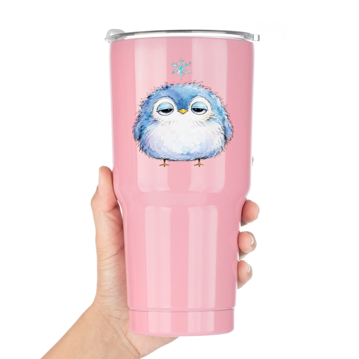 Sleepy Blue Bird Snowflake UV DTF sticker applied to a pink tumbler held against a white background