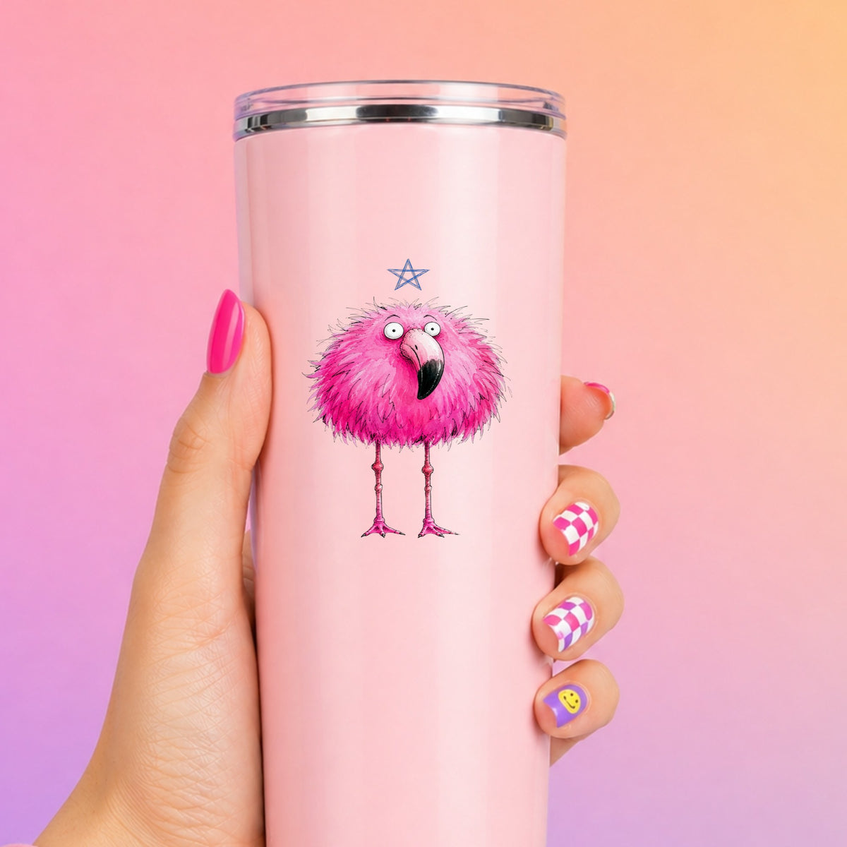 Pink Flamingo With Star UV DTF sticker applied to a tall pink tumbler on a pink and orange background