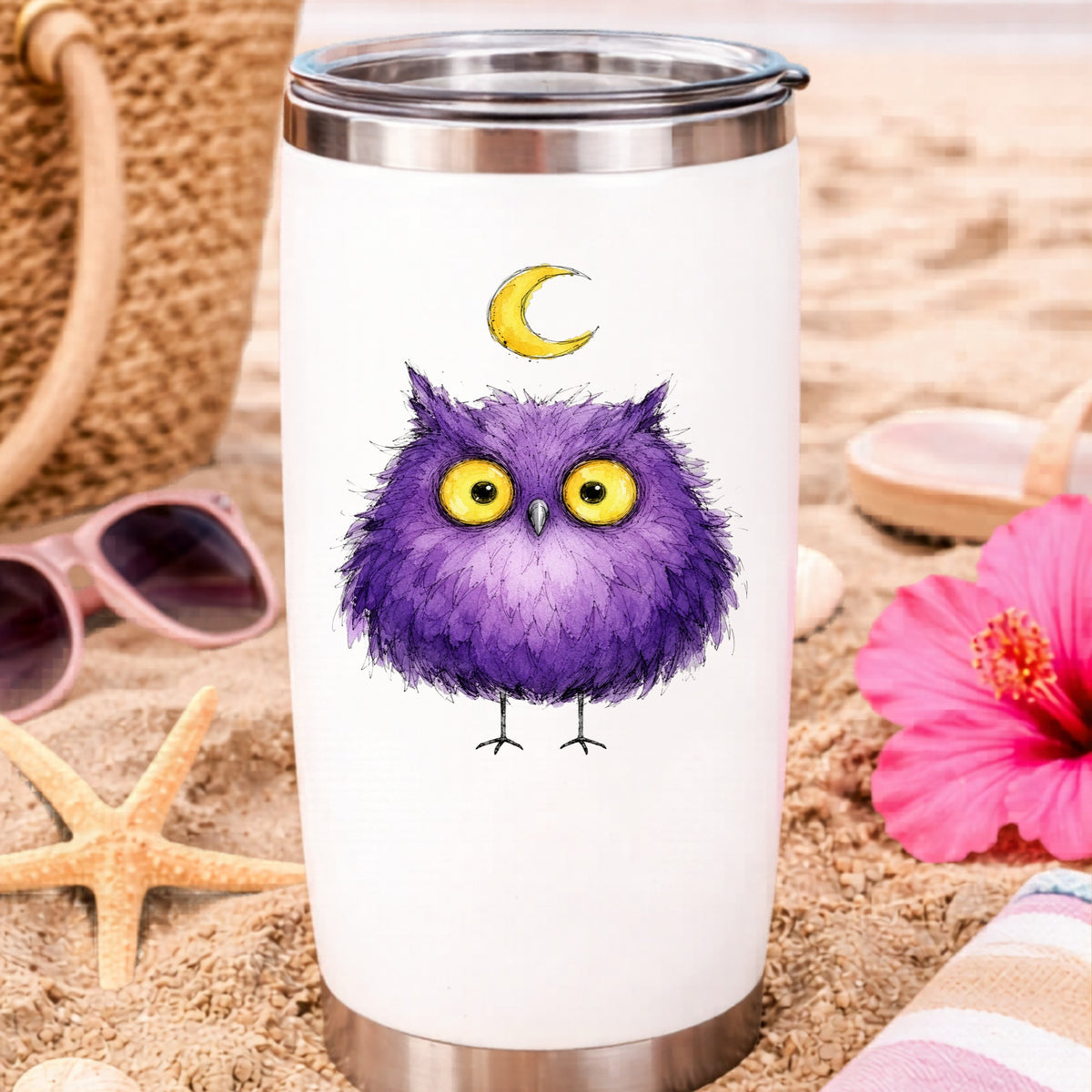 Purple Owl Crescent Moon UV DTF sticker applied to a white travel tumbler on beach sand