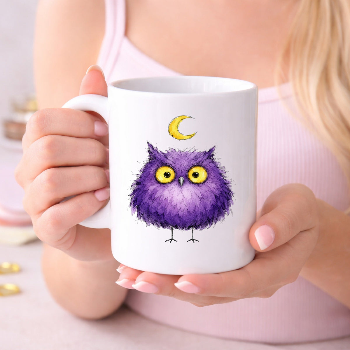 Purple Owl Crescent Moon UV DTF sticker applied to a white coffee mug held in both hands