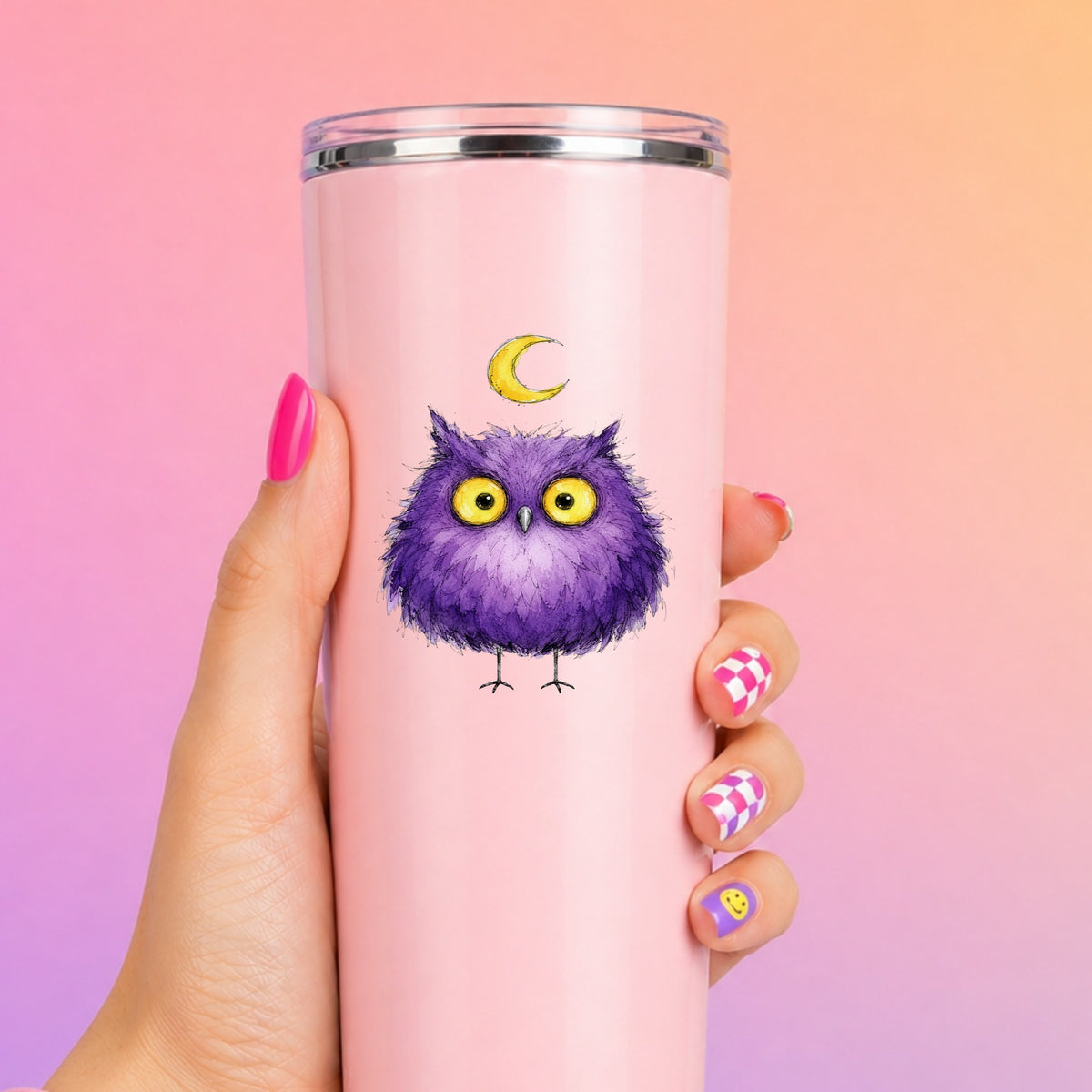 Purple Owl Crescent Moon UV DTF sticker applied to a tall pink tumbler on a pink and orange background