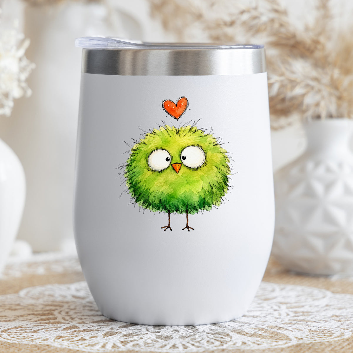 Fluffy Green Bird UV DTF sticker applied to a white stemless tumbler with a lid