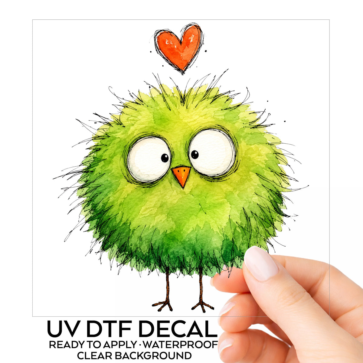 Fluffy Green Bird UV DTF sticker on its backing card, held in hand