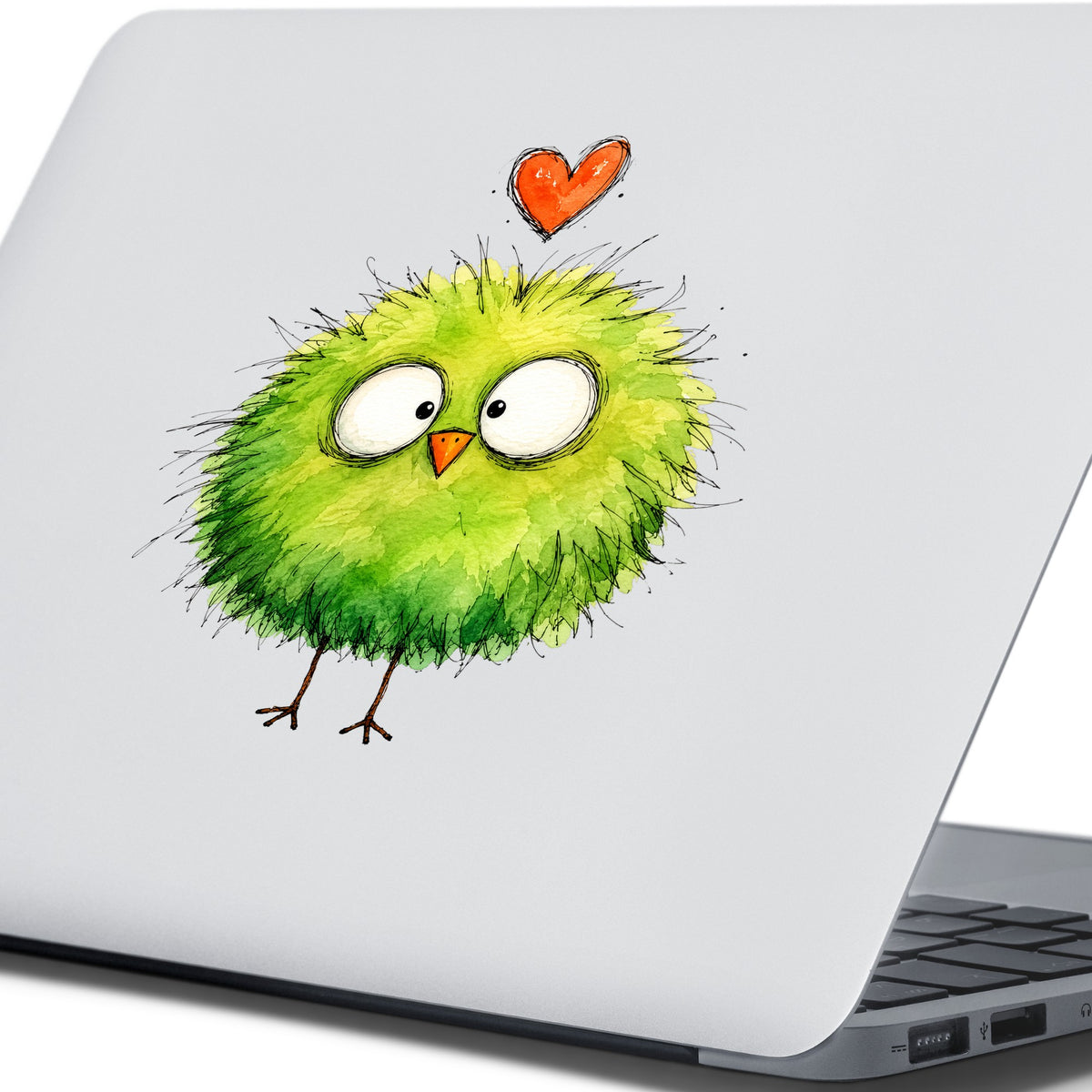Fluffy Green Bird UV DTF sticker applied to the lid of a silver laptop