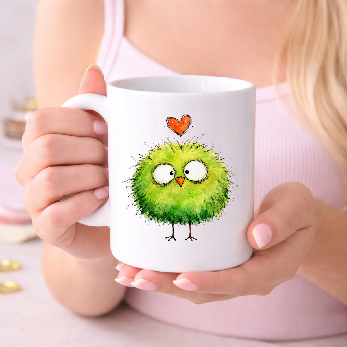 Fluffy Green Bird UV DTF sticker applied to a white coffee mug held in both hands