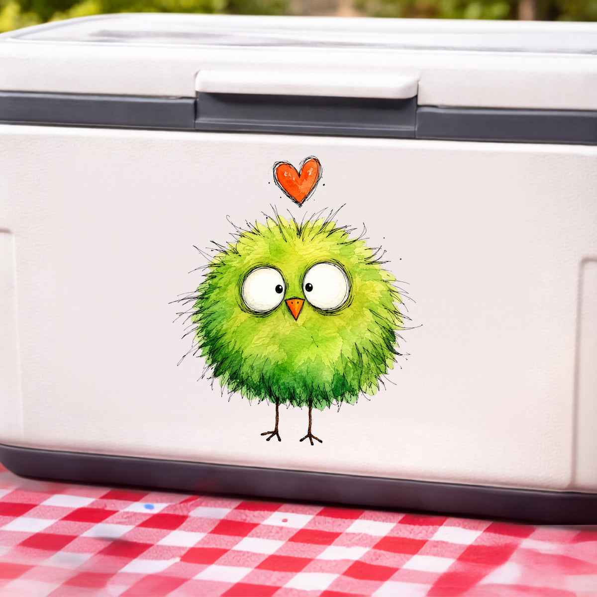 Fluffy Green Bird UV DTF sticker applied to a white cooler on a red gingham cloth