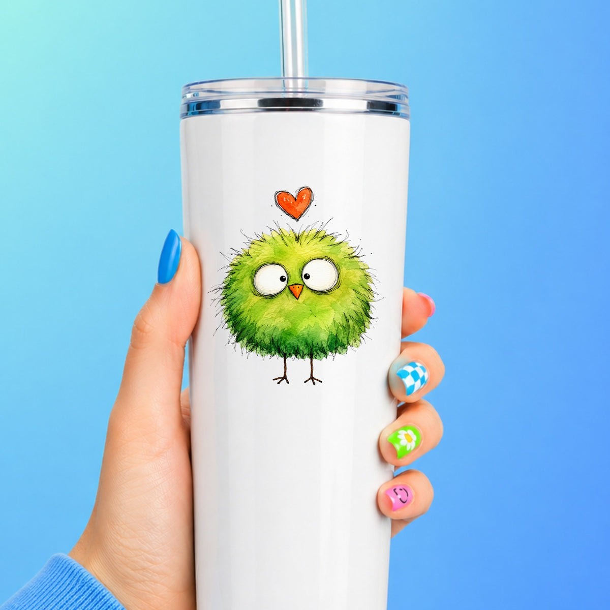 Fluffy Green Bird UV DTF sticker applied to a white straw tumbler on a blue background