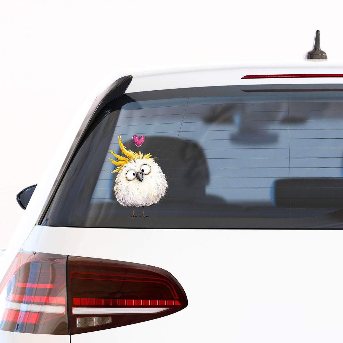 Funny White Cockatoo UV DTF sticker applied to the rear window of a white car