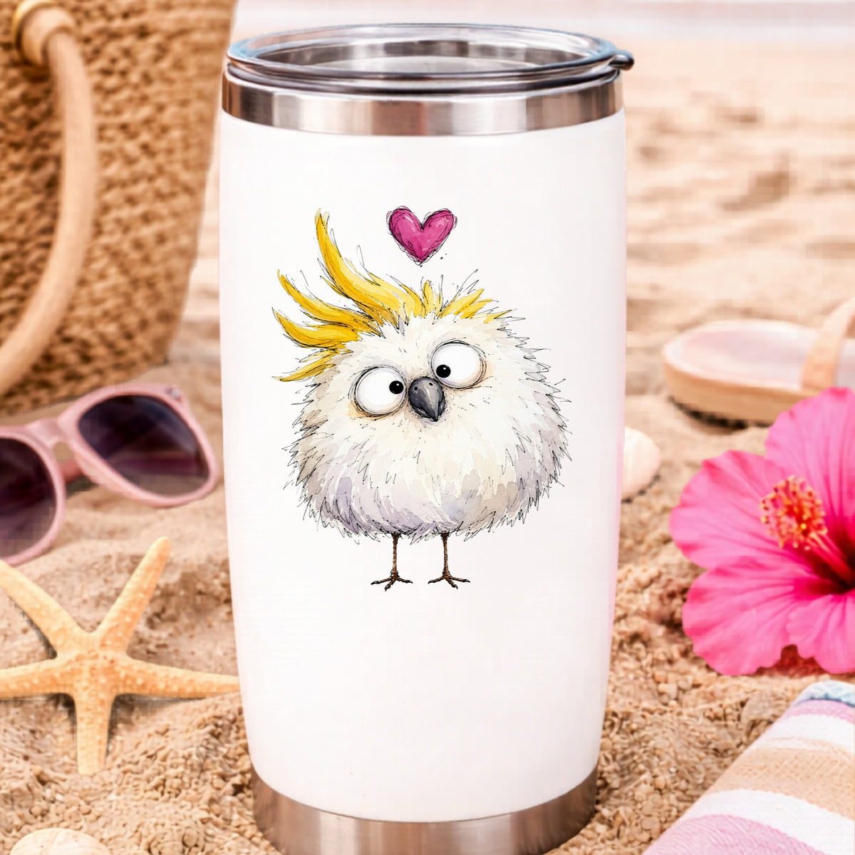Funny White Cockatoo UV DTF sticker applied to a white travel tumbler on beach sand