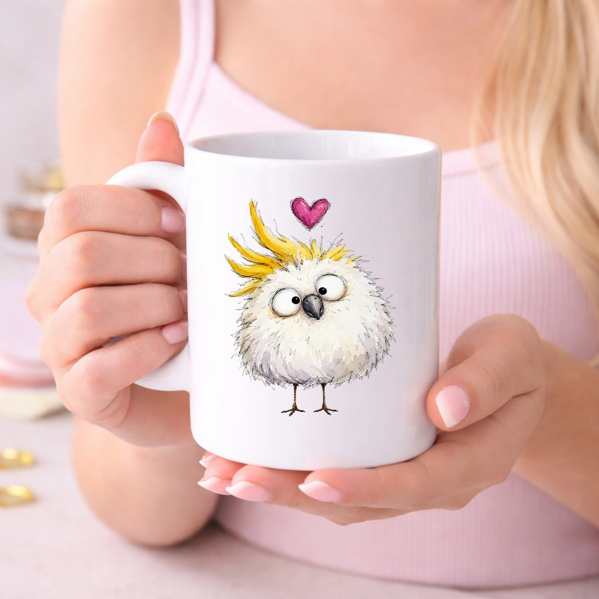 Funny White Cockatoo UV DTF sticker applied to a white coffee mug held in both hands
