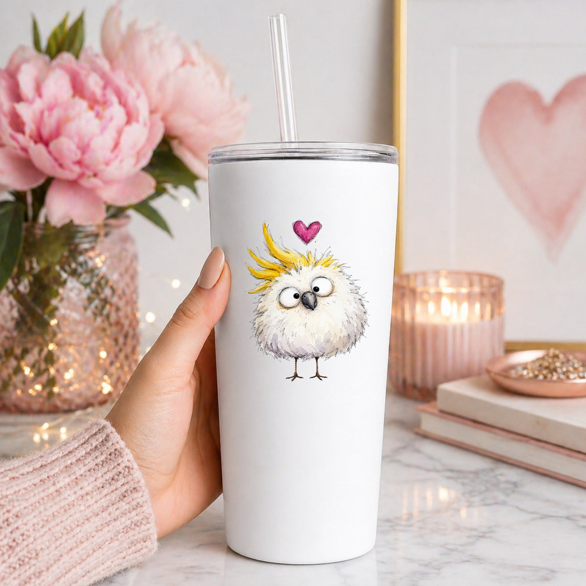 Funny White Cockatoo UV DTF sticker applied to a white straw tumbler beside pink peonies