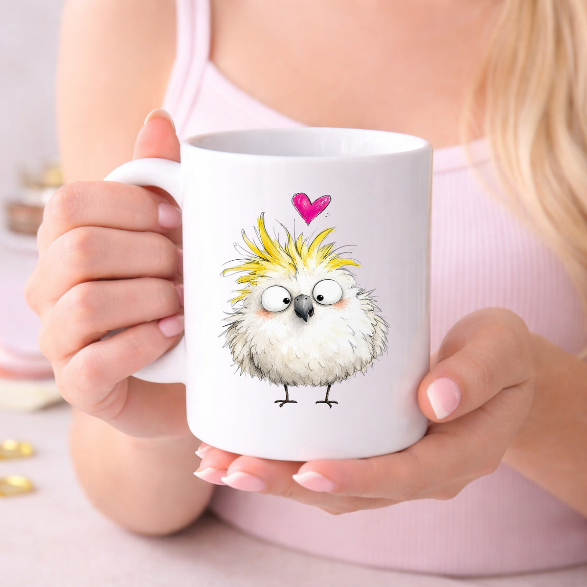 Cartoon Cockatoo Parrot UV DTF sticker applied to a white coffee mug held in both hands