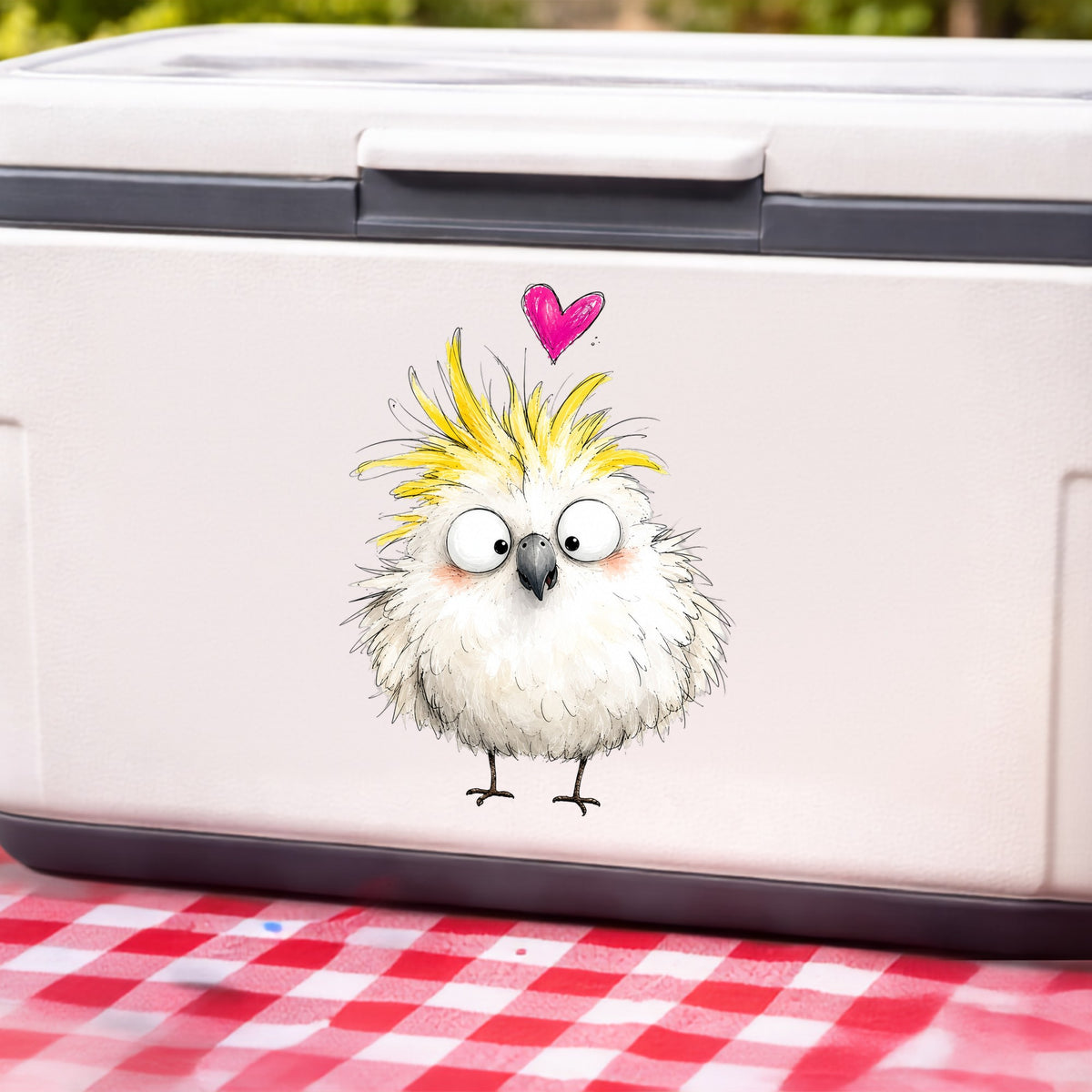 Cartoon Cockatoo Parrot UV DTF sticker applied to a white cooler on a red gingham cloth
