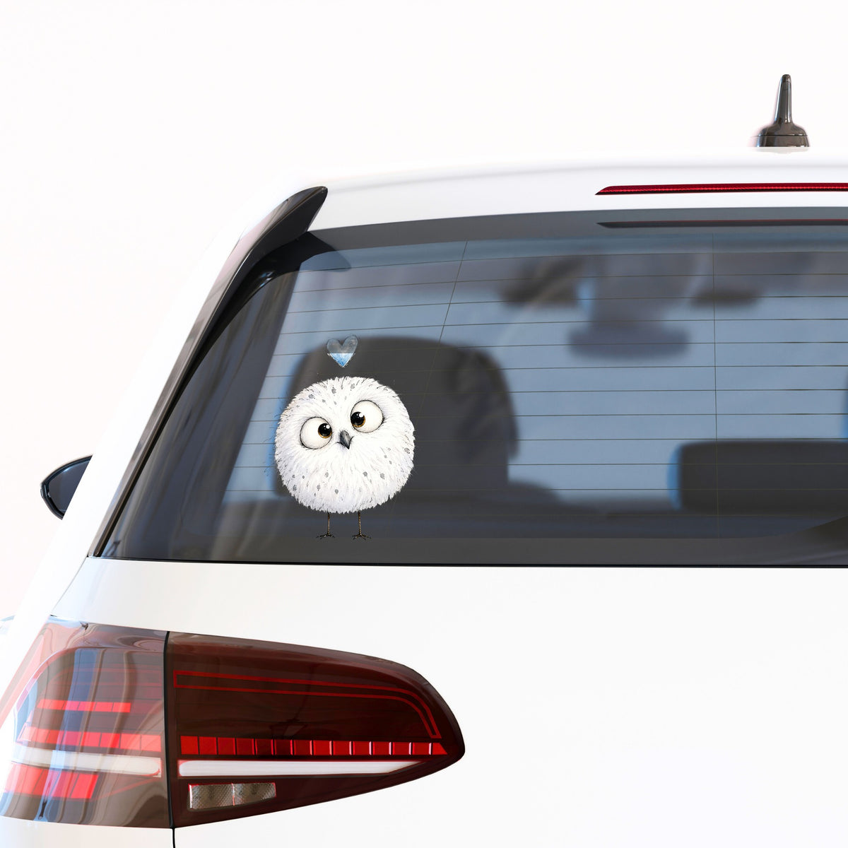 Round White Owl UV DTF sticker applied to the rear window of a white car