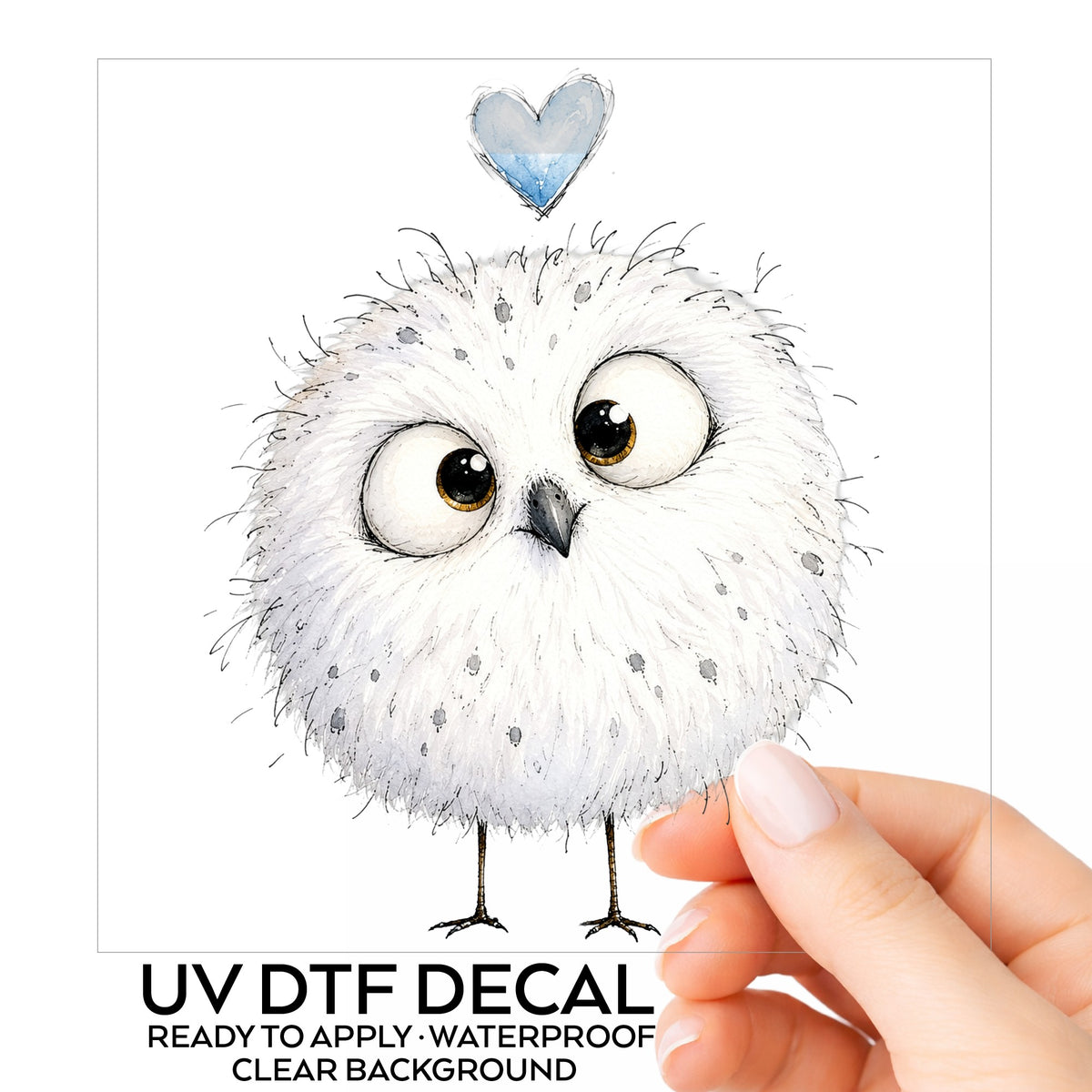 Round White Owl UV DTF sticker on its backing card, held in hand