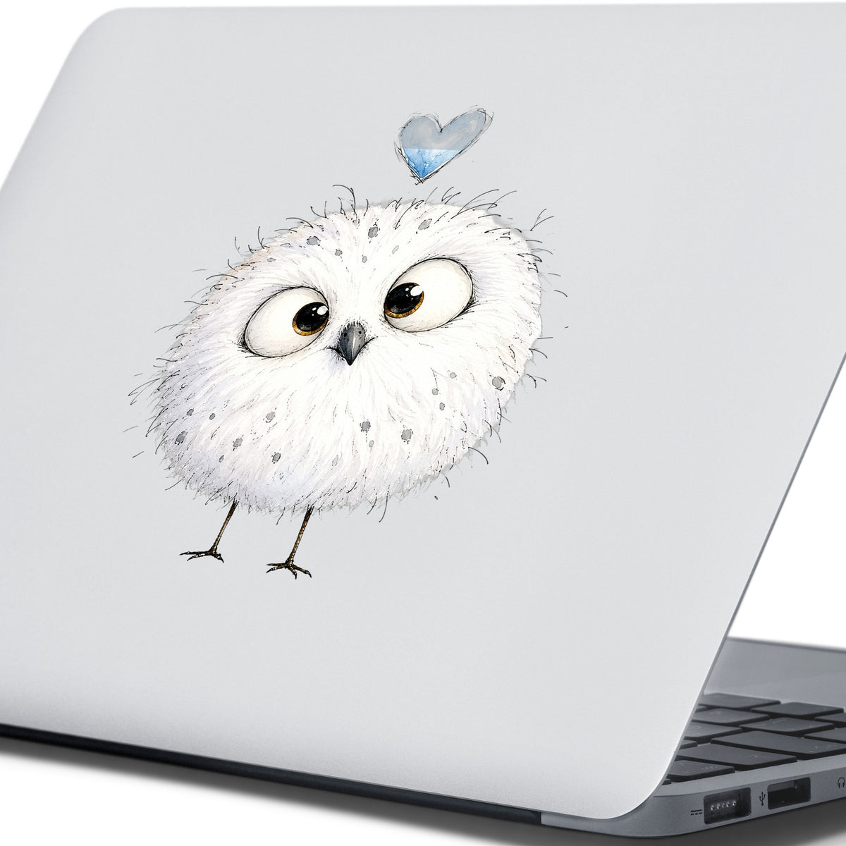 Round White Owl UV DTF sticker applied to the lid of a silver laptop