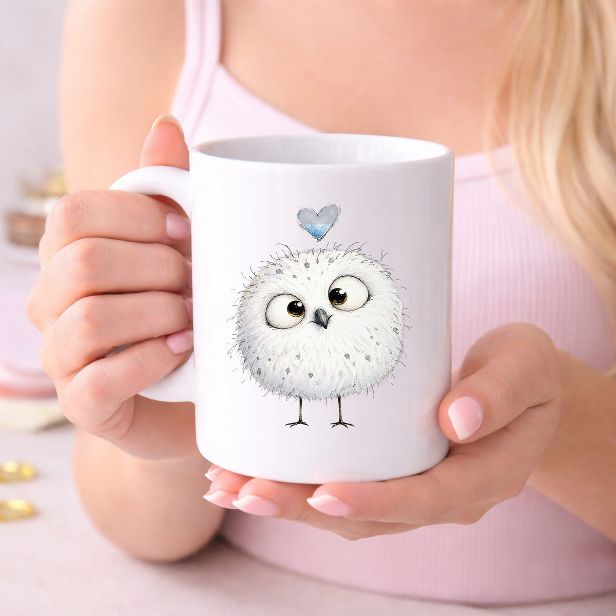 Round White Owl UV DTF sticker applied to a white coffee mug held in both hands