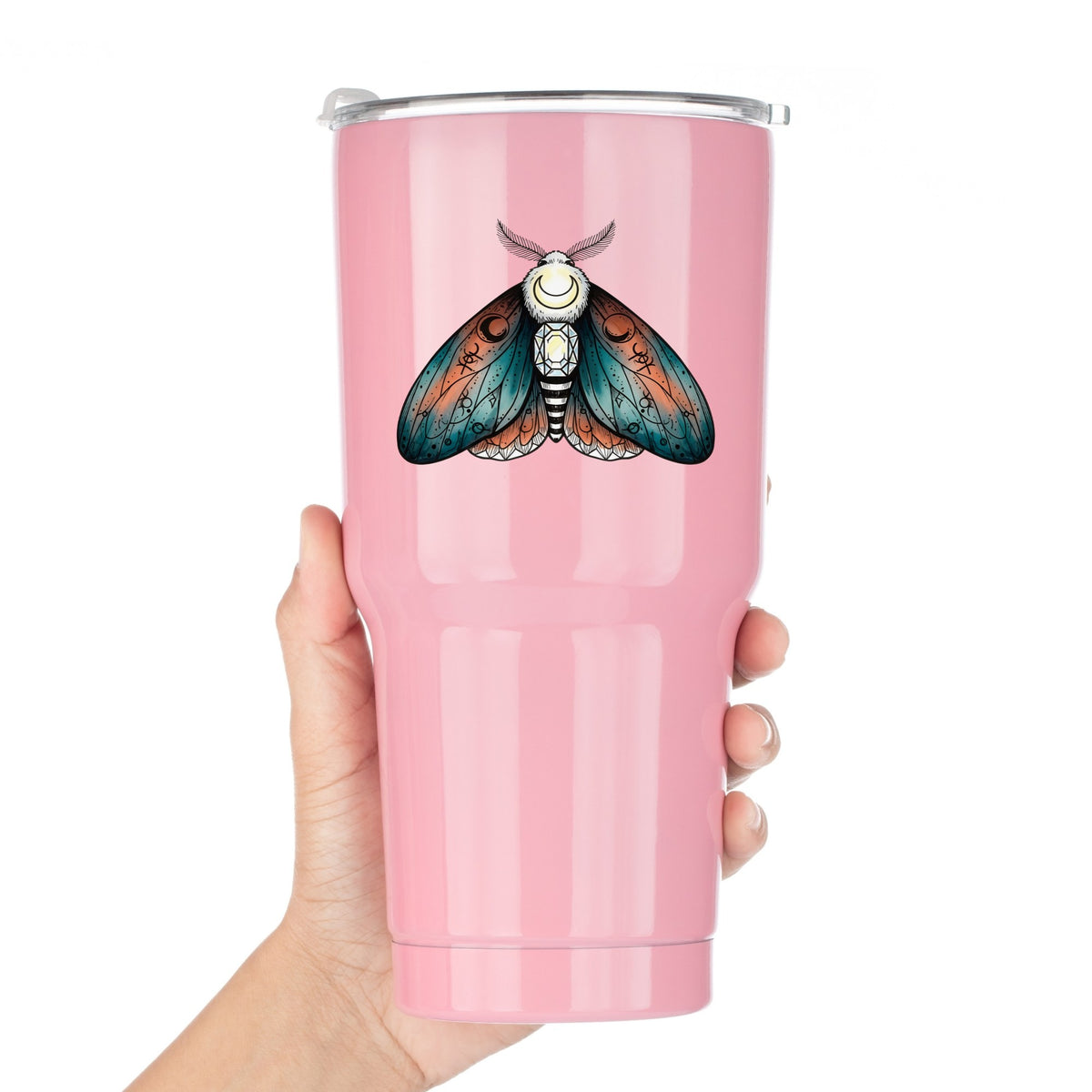 Coral Teal Crescent Moon Moth UV DTF sticker applied to a pink tumbler held against a white background