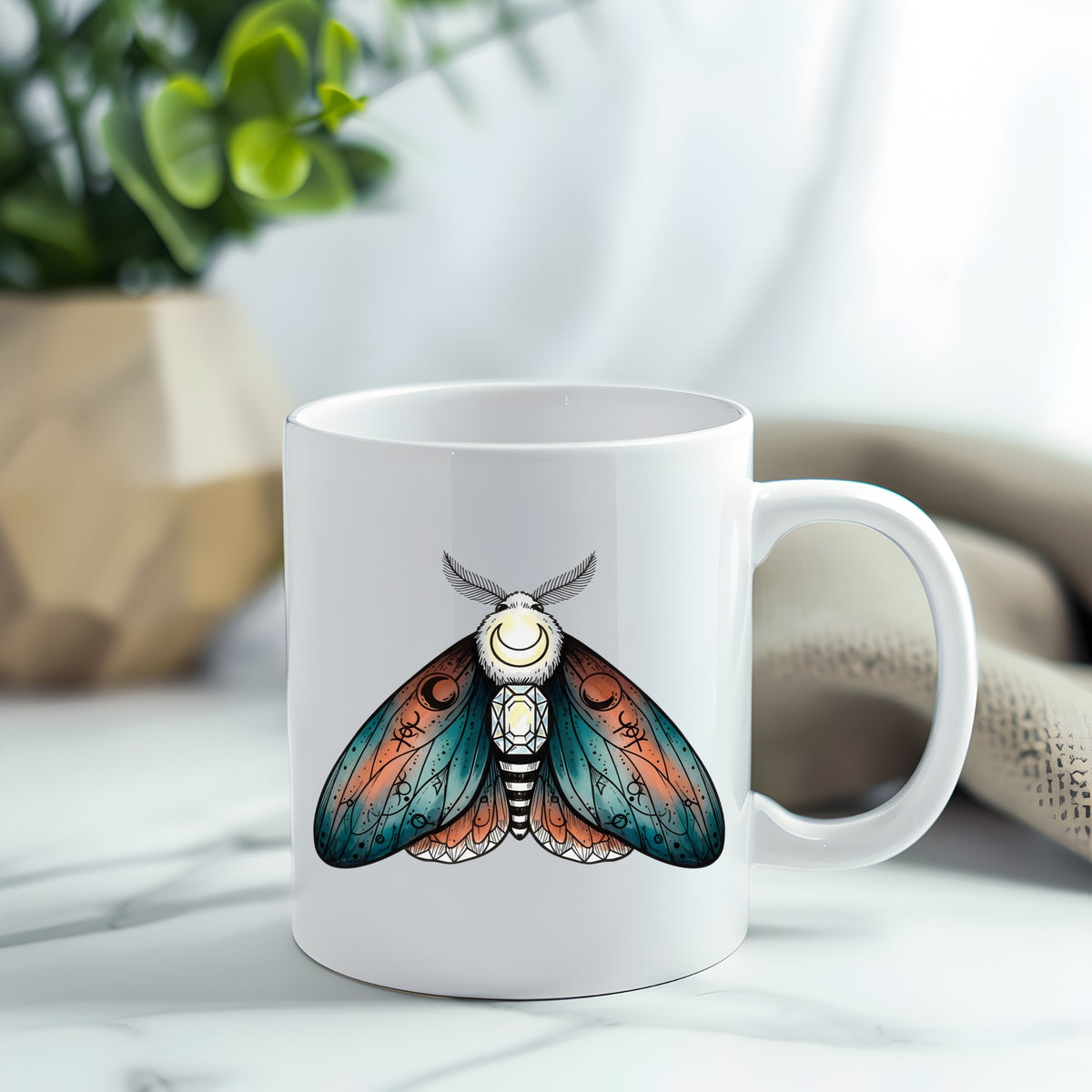 Coral Teal Crescent Moon Moth UV DTF sticker applied to a white coffee mug
