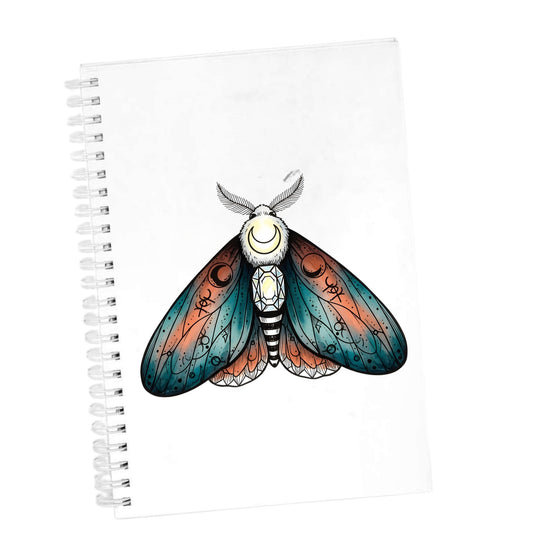 Coral Teal Crescent Moon Moth UV DTF sticker applied to the cover of a white spiral journal