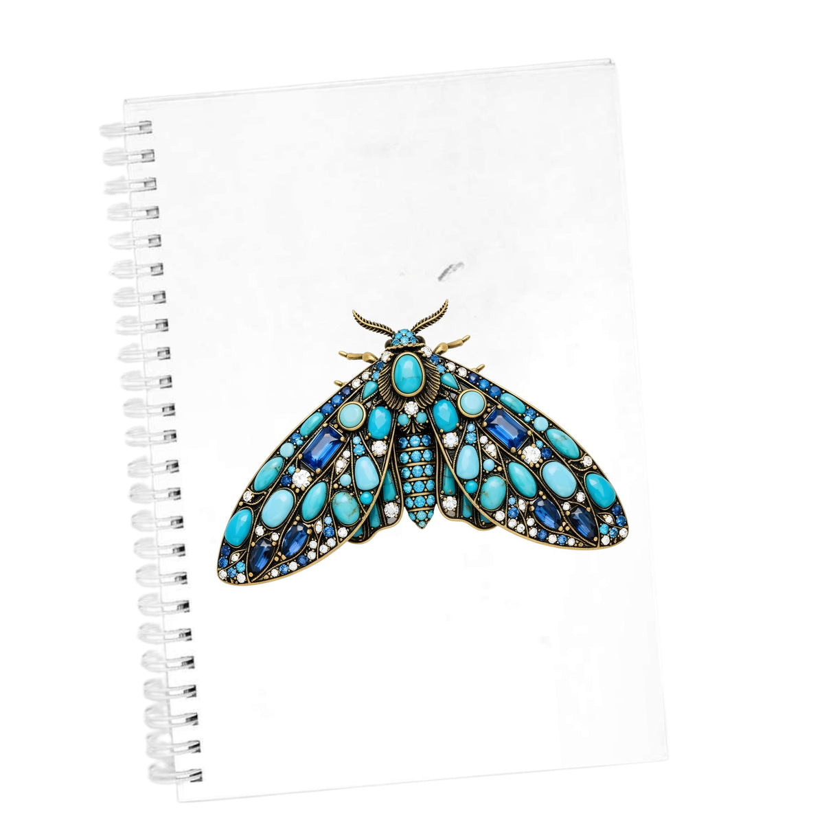 Turquoise Jeweled Moth UV DTF sticker applied to the cover of a white spiral journal