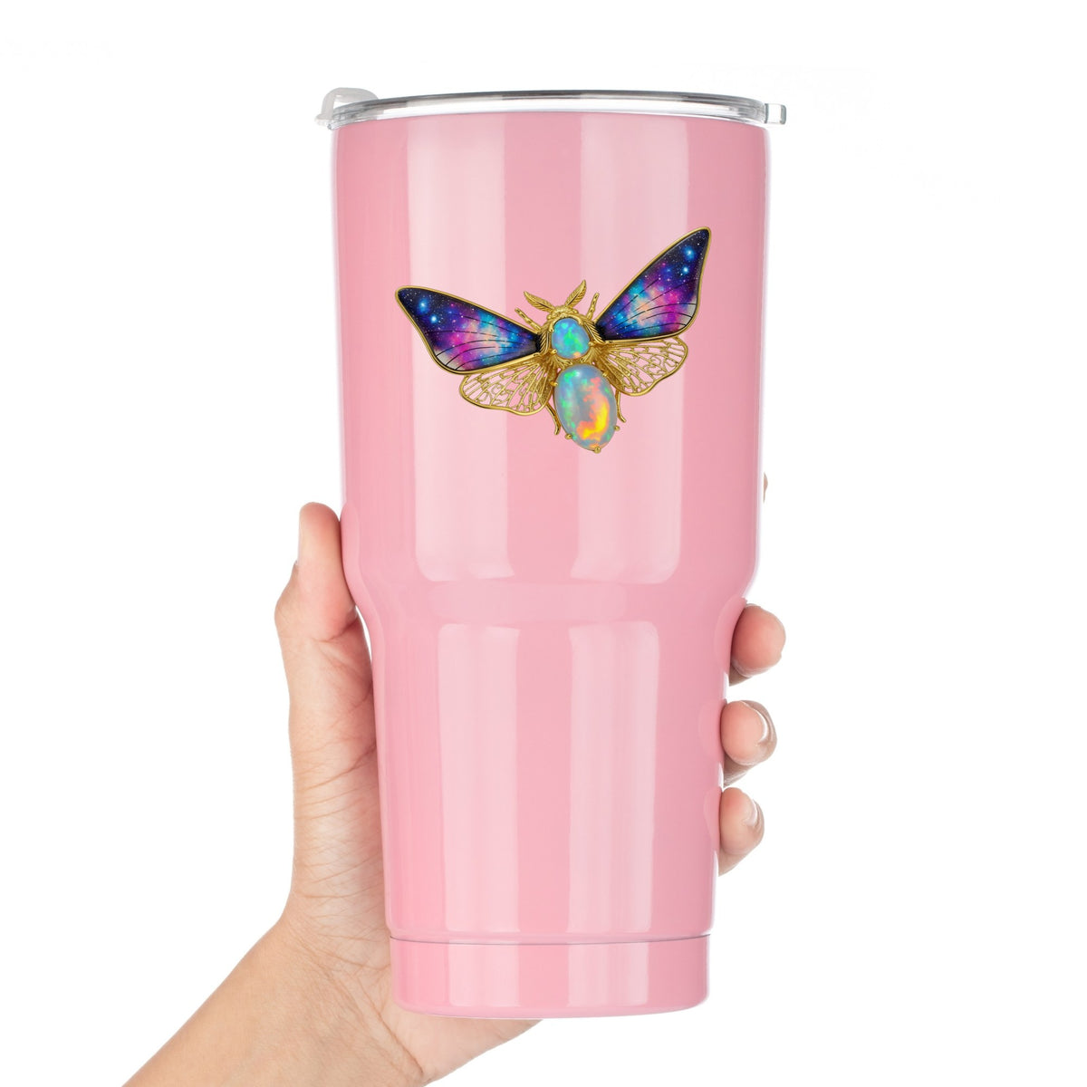 Opal Galaxy Moth UV DTF sticker applied to a pink tumbler held against a white background
